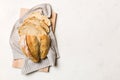 Freshly baked bread slices on cutting board against white wooden background. top view Sliced bread Royalty Free Stock Photo