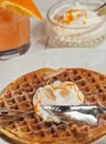 Freshly, baked carrot cake waffle with orange and coconut cream Royalty Free Stock Photo