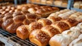 Freshly baked challah bread on bakery rack