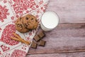 freshly baked chocolate chip cookies on rustic wooden table Royalty Free Stock Photo