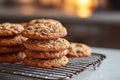 Freshly Baked Chocolate Chip Cookies Stacked on a Cooling Rack with Warm Background Royalty Free Stock Photo