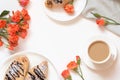 Freshly baked chocolate croissants and cup of coffee on white table. Top view. Female breakfast. Copy space. Royalty Free Stock Photo