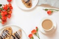 Freshly baked chocolate croissants and cup of coffee on white. Top view. Female spring breakfast concept. Copy space. Royalty Free Stock Photo