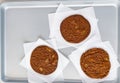 Freshly baked chocolate ginger snap cookies on the baking sheet on a table close-up. Royalty Free Stock Photo