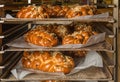 Freshly baked Christmas cakes on a rack in the oven. detail of christmas cake sprinkled with almonds on wooden background, Typical Royalty Free Stock Photo