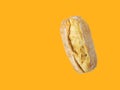 Freshly baked ciabatta bread loaf on yellow background. Bread making concept. Poster banner for bakeries