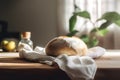 Freshly baked ciabatta bread on a white kitchen towel on a wooden table. Generative AI