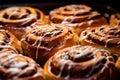 Freshly baked cinnamon buns with frosting. Generative AI