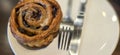 freshly baked Cinnamon rolls or cinnamon bun with raisins and vanilla also icing sugar ridiculously good Royalty Free Stock Photo