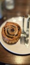 freshly baked Cinnamon rolls or cinnamon bun with raisins and vanilla also icing sugar ridiculously good Royalty Free Stock Photo