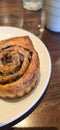 freshly baked Cinnamon rolls or cinnamon bun with raisins and vanilla also icing sugar ridiculously good Royalty Free Stock Photo