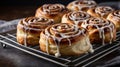 Delicious Cinnamon Rolls on a Cooling Rack with Sweet Cream Cheese Glaze Royalty Free Stock Photo