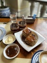 Freshly baked coconut scones, cream and homemade pineapple preserve