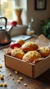 Freshly baked cornbread muffins in a wooden box on a rustic kitchen table Royalty Free Stock Photo