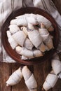 Freshly baked crescent with poppy stuffing close-up. Vertical to Royalty Free Stock Photo