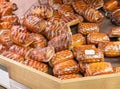 Freshly baked crispy bread buns on a counter or shelf in a store, close-up. Bakery products are sold in the market. Fresh bakery. Royalty Free Stock Photo