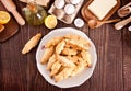 Freshly baked croissant on the plate with ingredients and kitchen utencil on the wooden table. Top view. Royalty Free Stock Photo