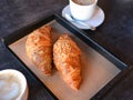 Freshly baked croissants with aromatic coffee Royalty Free Stock Photo
