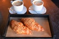 Freshly baked croissants with aromatic coffee Royalty Free Stock Photo