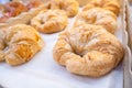 Freshly baked croissants on baking tray - Close up