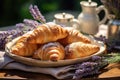 Plate with croissants and a bunch of lavender