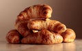 Freshly baked croissants on a beige ceramic table