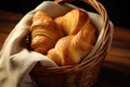 freshly baked croissants in a handwoven basket