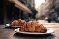 Freshly baked croissants on a table in a cafe. Delicious french croissants with coffee on a wooden table, AI Generated Royalty Free Stock Photo