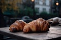 Freshly baked croissants on the table in a cafe. Delicious French croissants with coffee on a wooden table, AI Generated Royalty Free Stock Photo