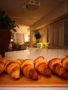 Freshly baked croissants on the table, a photo taken with a smartphone Royalty Free Stock Photo
