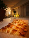 Freshly baked croissants on the table, a photo taken with a smartphone Royalty Free Stock Photo