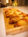 Freshly baked croissants on the table, a photo taken with a smartphone Royalty Free Stock Photo