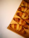 Freshly baked croissants on the table, a photo taken with a smartphone Royalty Free Stock Photo