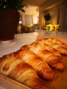 Freshly baked croissants on the table, a photo taken with a smartphone Royalty Free Stock Photo