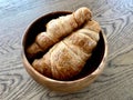 Freshly Baked Croissants in Wooden Bowl. Bakery Concept Royalty Free Stock Photo