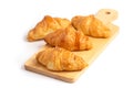 Freshly baked croissants on wooden cutting board Royalty Free Stock Photo