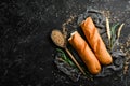 Freshly baked delicious baguette. Baking from rye and flour. Top view. Rustic style