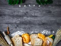 Freshly baked delicious bread and croissant on a wooden worktop