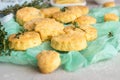 Freshly baked delicious english scones or cookies with cheese and thyme. Royalty Free Stock Photo