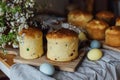 Freshly baked easter cakes, traditional ukrainian bun. Homemade easter breads, natural dyed eggs and spring blossom on rustic Royalty Free Stock Photo