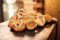 Freshly baked every day. Closeup shot of a selection of freshly baked bread on a wooden table.