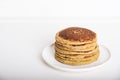 Freshly baked farinata pancakes on white background.