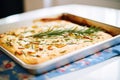 freshly baked focaccia bread with rosemary on top Royalty Free Stock Photo