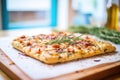 freshly baked focaccia bread with rosemary on top Royalty Free Stock Photo