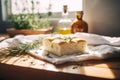 Freshly baked focaccia bread on a white kitchen towel on a wooden table. Generative AI