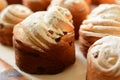 Freshly baked fresh cruffins with raisins, dried apricots and powdered sugar.