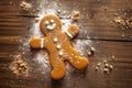 Freshly baked gingerbread man sitting on the kitchen table. Conceptual Christmas illustration. Generative AI