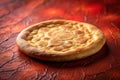 A freshly baked, golden-brown flatbread rests on a textured surface, its crust exhibiting a delightful array of subtle, uneven Royalty Free Stock Photo