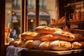 Freshly baked gourmet breads for sale in French bakery. Baguettes on early sunny morning in small town in France Royalty Free Stock Photo