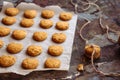 Freshly baked heart-shaped cookies on parchment paper, lavender flower